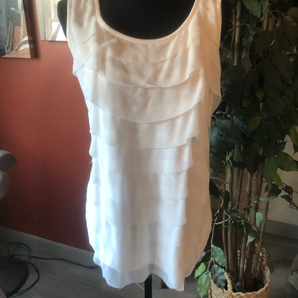 Sleeveless white ruffle tank